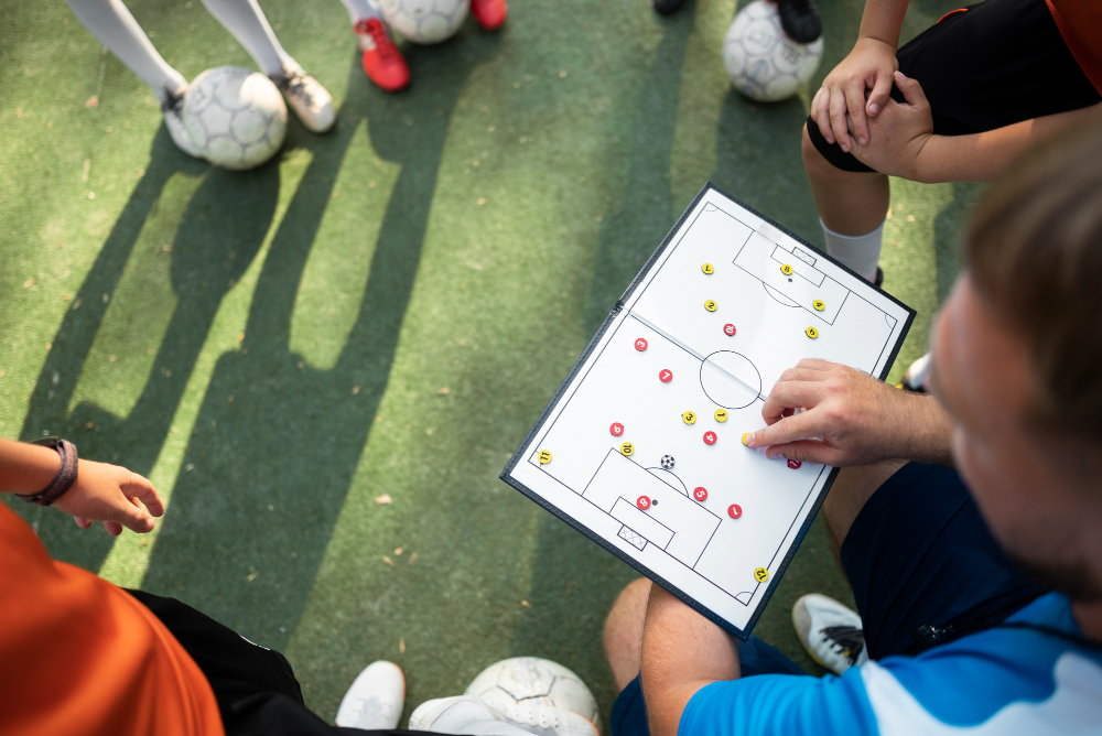 football-trainer-teaching-his-pupils